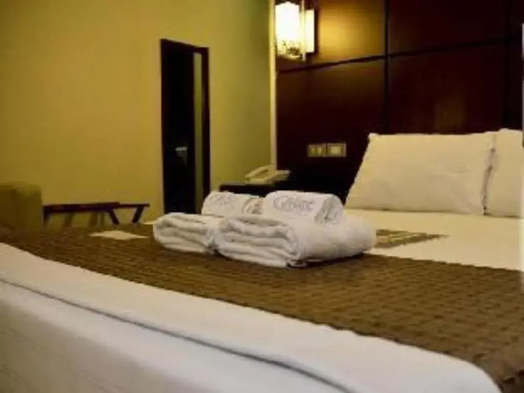 Bed in The Grande Suites Bed in The Grande Suites