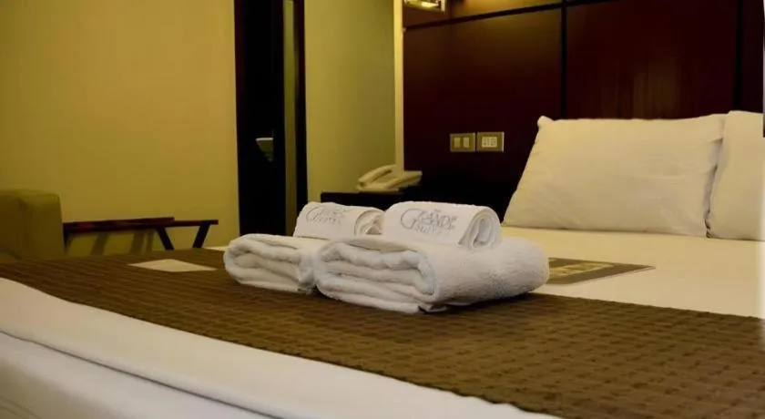 Bed in The Grande Suites