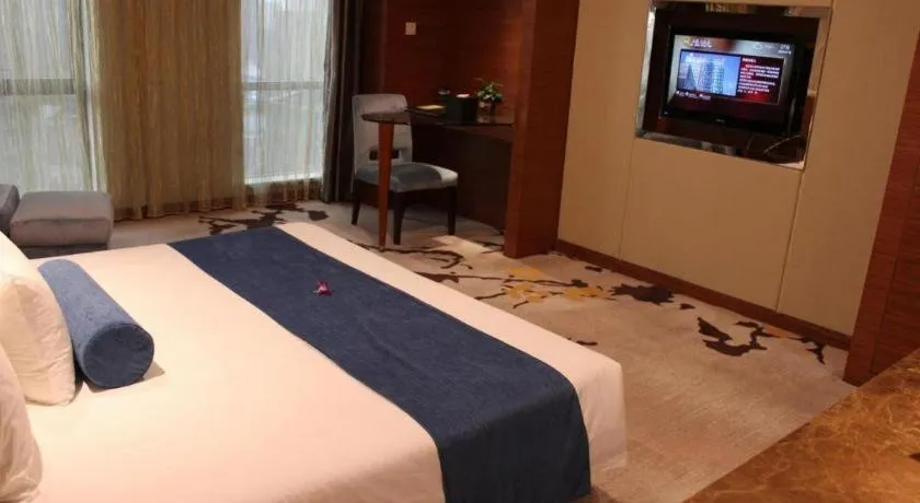 Bed in Ningbo East Shipu Hotel
