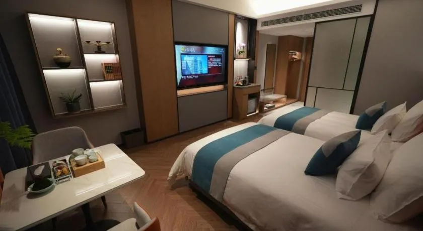 Bed in Ningbo East Shipu Hotel