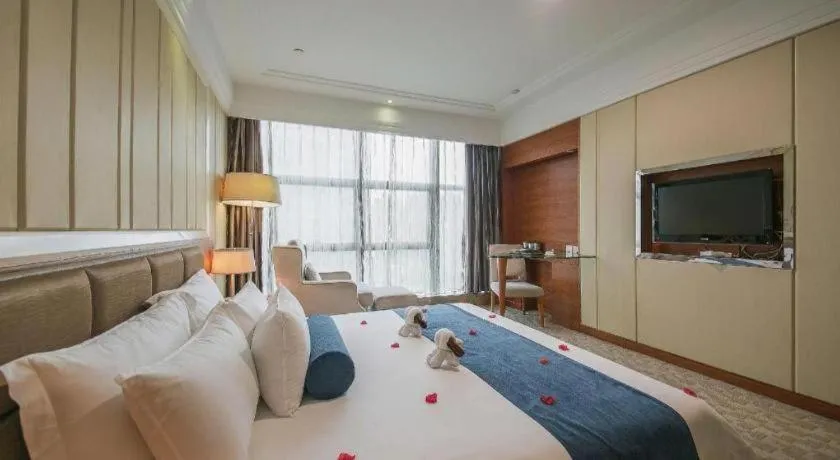 Bed in Ningbo East Shipu Hotel
