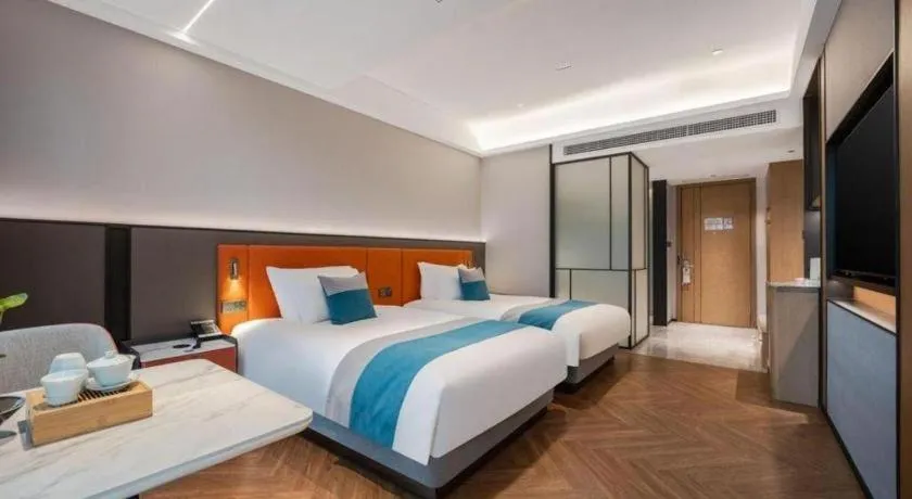 Bed in Ningbo East Shipu Hotel