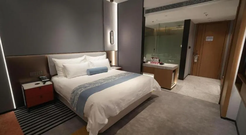 Bed in Ningbo East Shipu Hotel