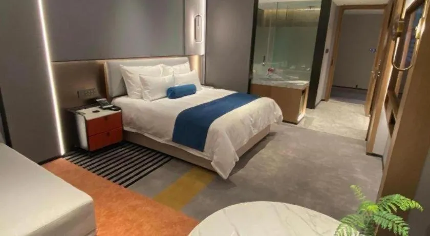 Bed in Ningbo East Shipu Hotel