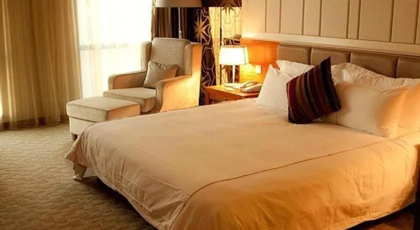 Bed in Ningbo East Shipu Hotel