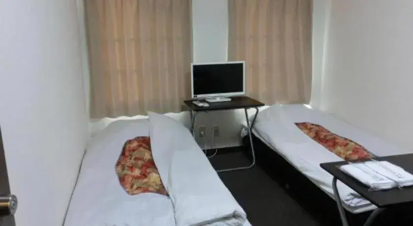 Bed in New Shochikubai Hotel Bed in New Shochikubai Hotel