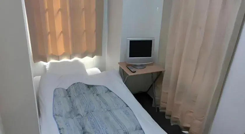 Bed in New Shochikubai Hotel Bed in New Shochikubai Hotel