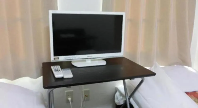 Bed in New Shochikubai Hotel