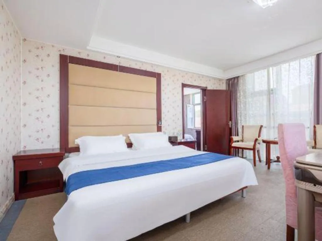 Bed in Weihai Huayu Business Hotel