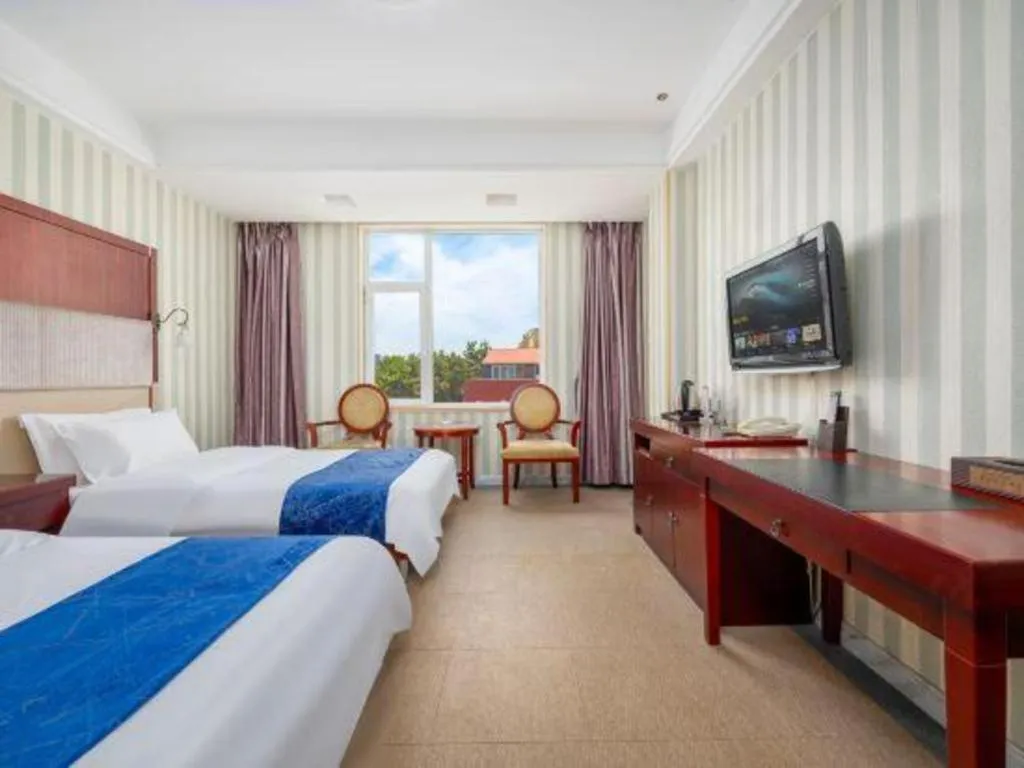 Bed in Weihai Huayu Business Hotel