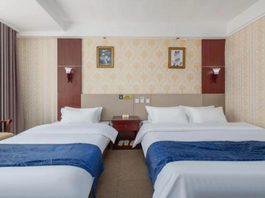 Bed in Weihai Huayu Business Hotel