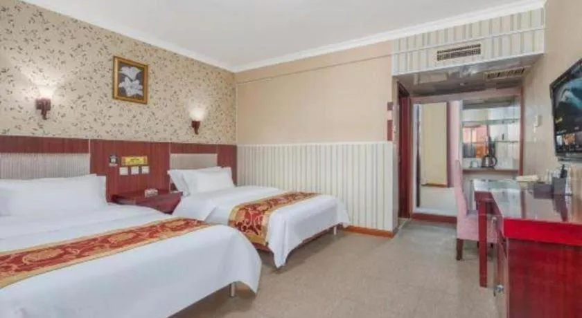 Bed in Weihai Huayu Business Hotel