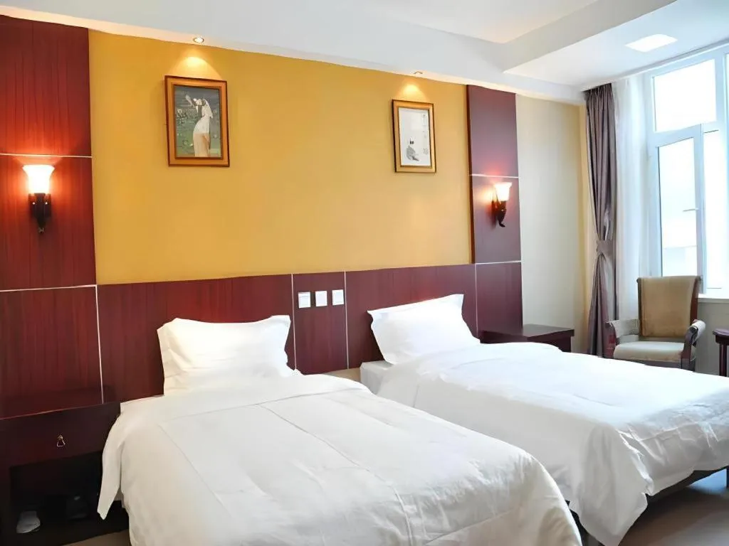 Bed in Weihai Huayu Business Hotel