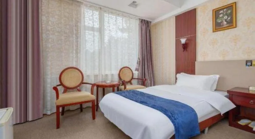 Bed in Weihai Huayu Business Hotel