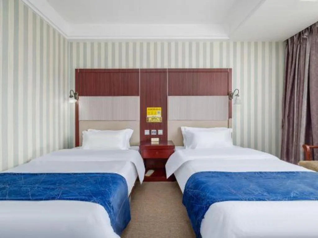 Bed in Weihai Huayu Business Hotel
