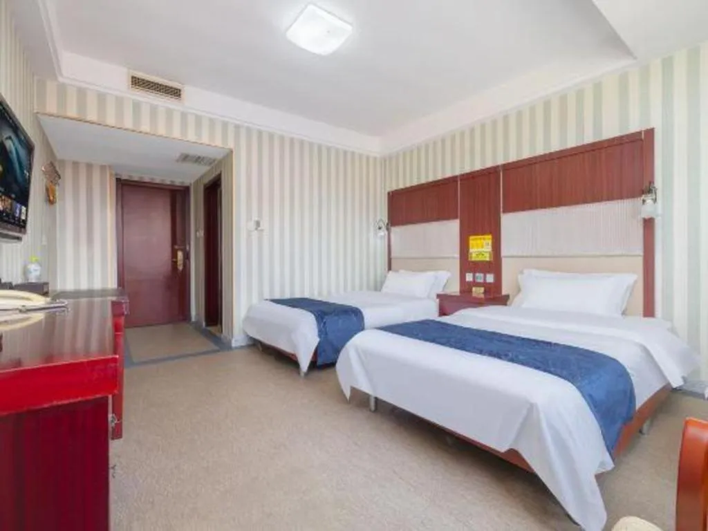 Bed in Weihai Huayu Business Hotel