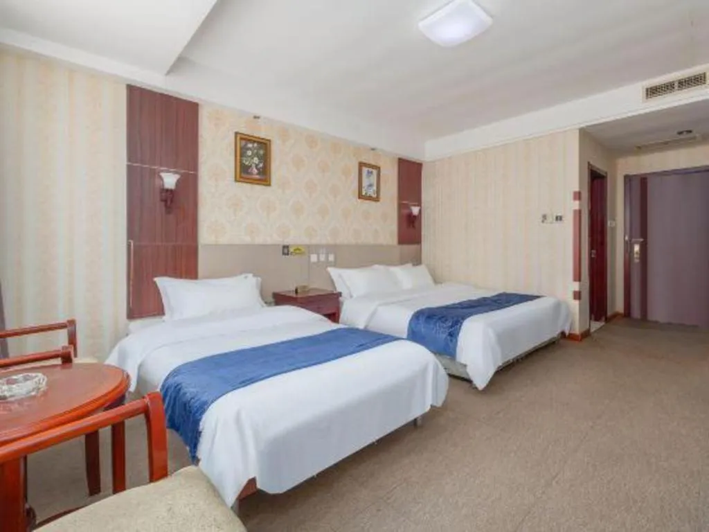 Bed in Weihai Huayu Business Hotel