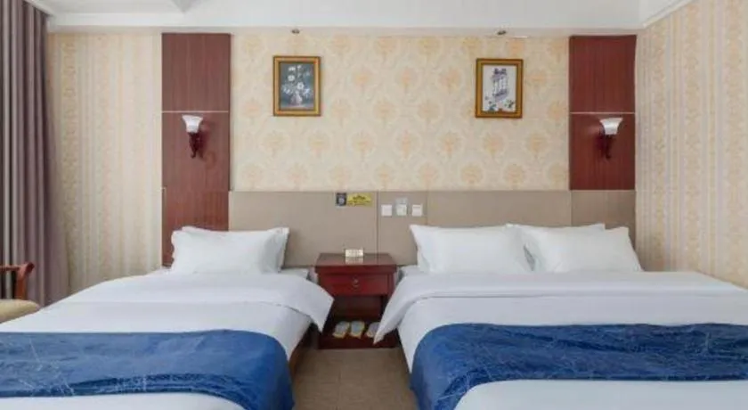 Bed in Weihai Huayu Business Hotel