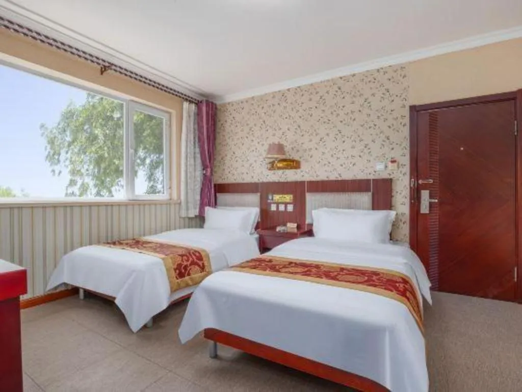 Bed in Weihai Huayu Business Hotel