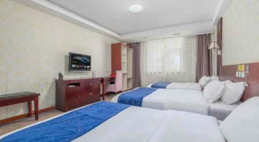Bed in Weihai Huayu Business Hotel