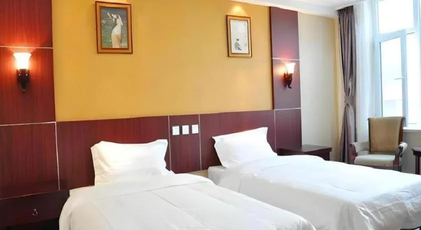 Bed in Weihai Huayu Business Hotel