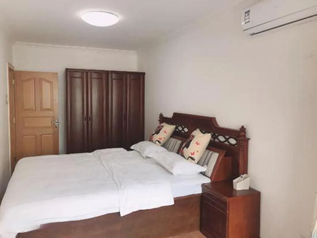 Bed in Weihai Huayu Business Hotel