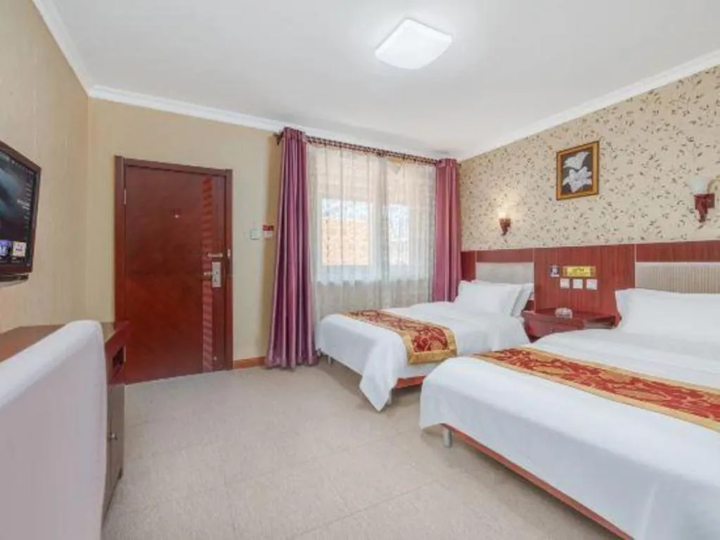 Bed in Weihai Huayu Business Hotel