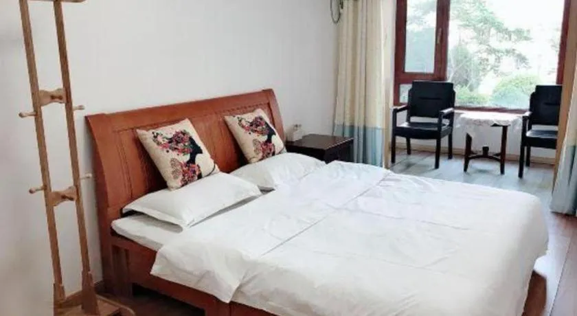 Bed in Weihai Huayu Business Hotel