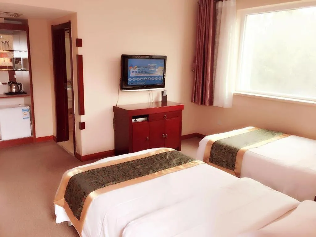 Bed in Weihai Huayu Business Hotel