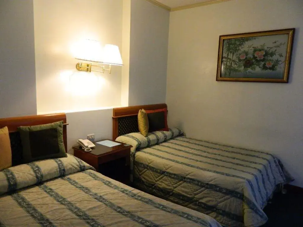 Bed in DJ Paradise Hotel Bed in DJ Paradise Hotel