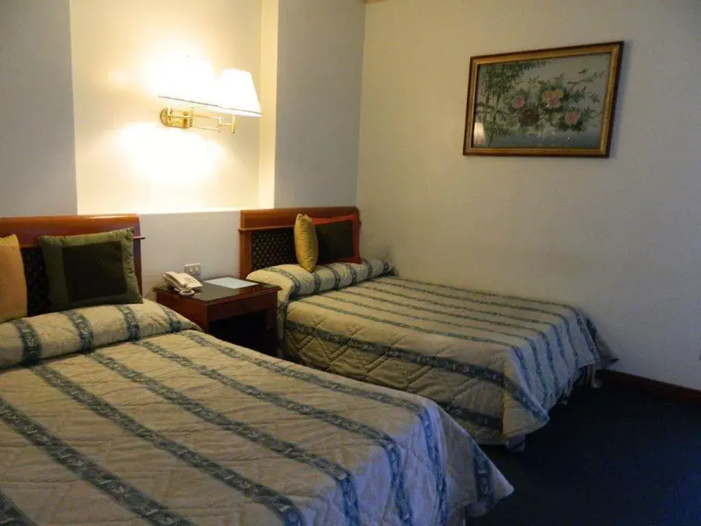 Bed in DJ Paradise Hotel Bed in DJ Paradise Hotel