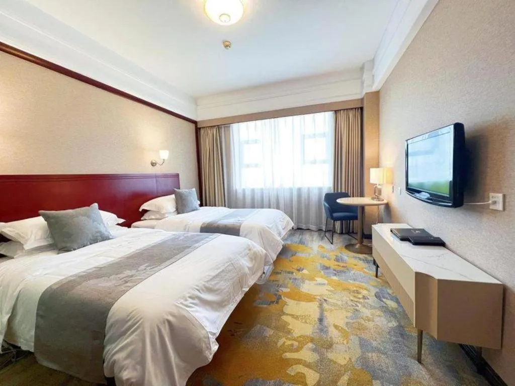 Bed in Kunming Zhong Huang Hotel