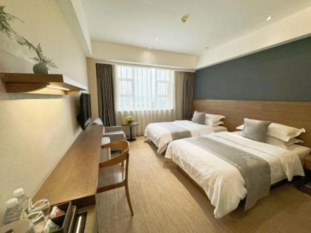 Bed in Kunming Zhong Huang Hotel