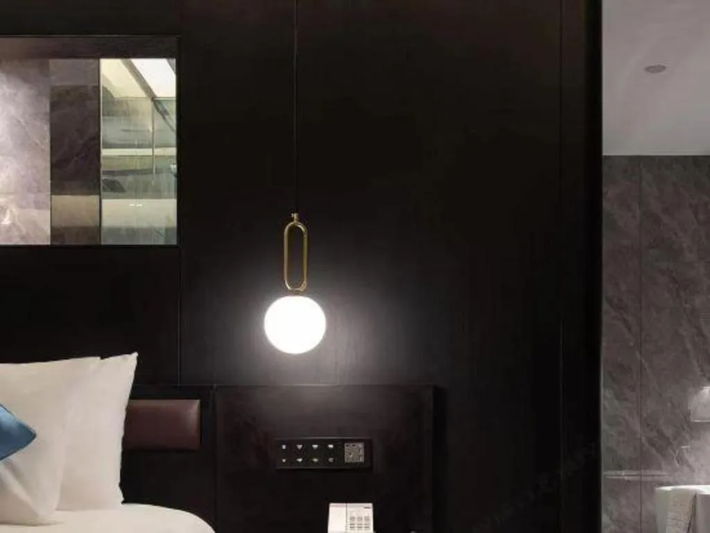 Bed in Kunming Zhong Huang Hotel