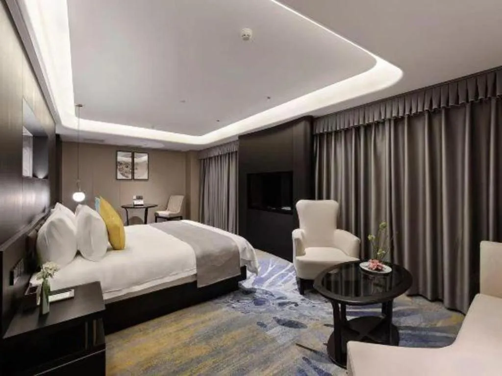 Bed in Kunming Zhong Huang Hotel