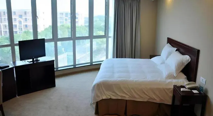Bed in GreenTree Inn Shanghai Songjiang Xinqiao Jiuxin Road Express Hotel Bed in GreenTree Inn Shanghai Songjiang Xinqiao Jiuxin Road Express Hotel
