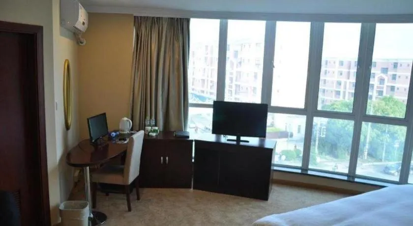 Bed in GreenTree Inn Shanghai Songjiang Xinqiao Jiuxin Road Express Hotel