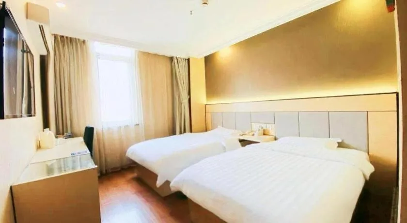 Bed in GreenTree Inn Shanghai Songjiang Xinqiao Jiuxin Road Express Hotel