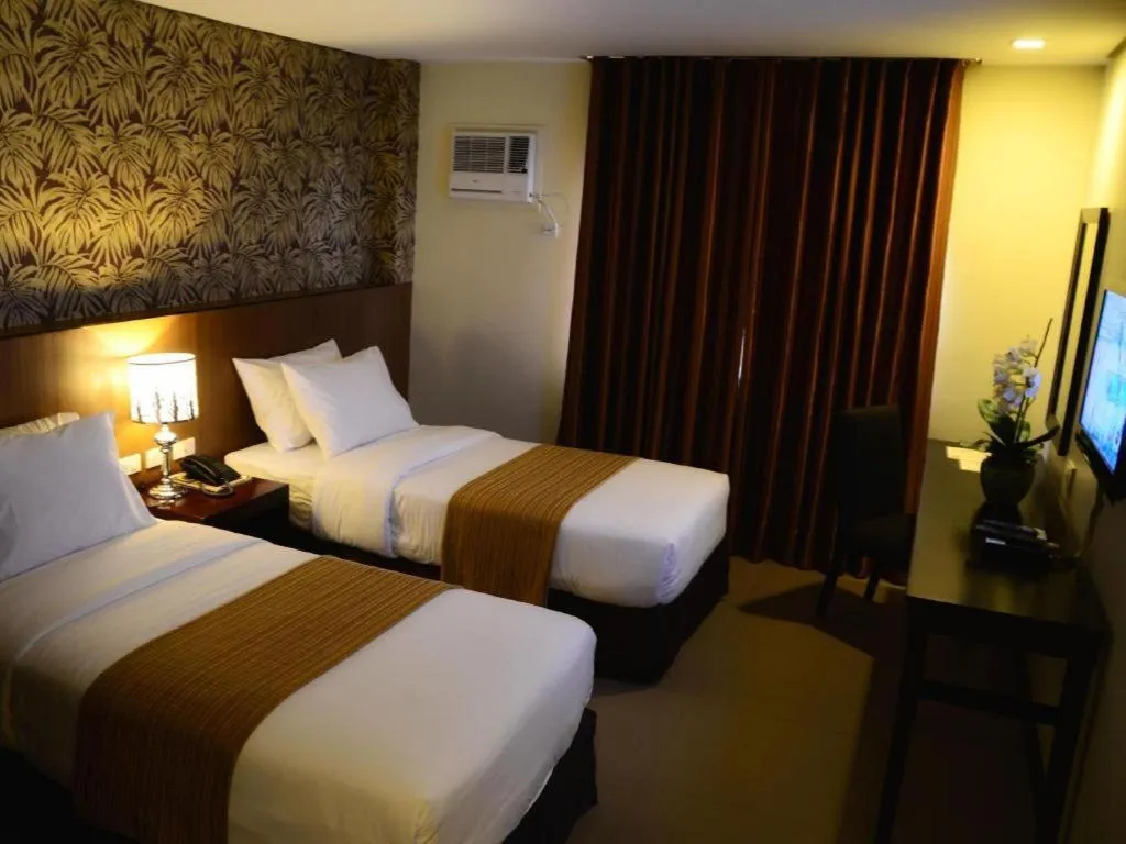 Bed in GT Hotel Bacolod