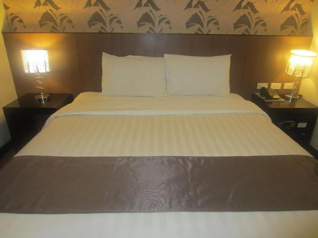 Bed in GT Hotel Bacolod