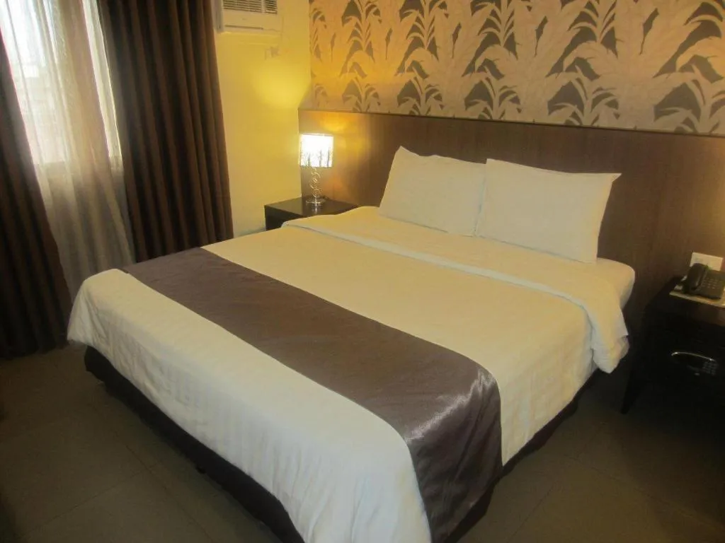 Bed in GT Hotel Bacolod