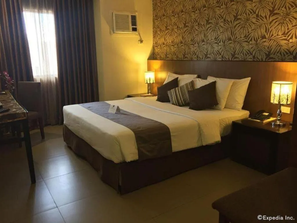 Bed in GT Hotel Bacolod
