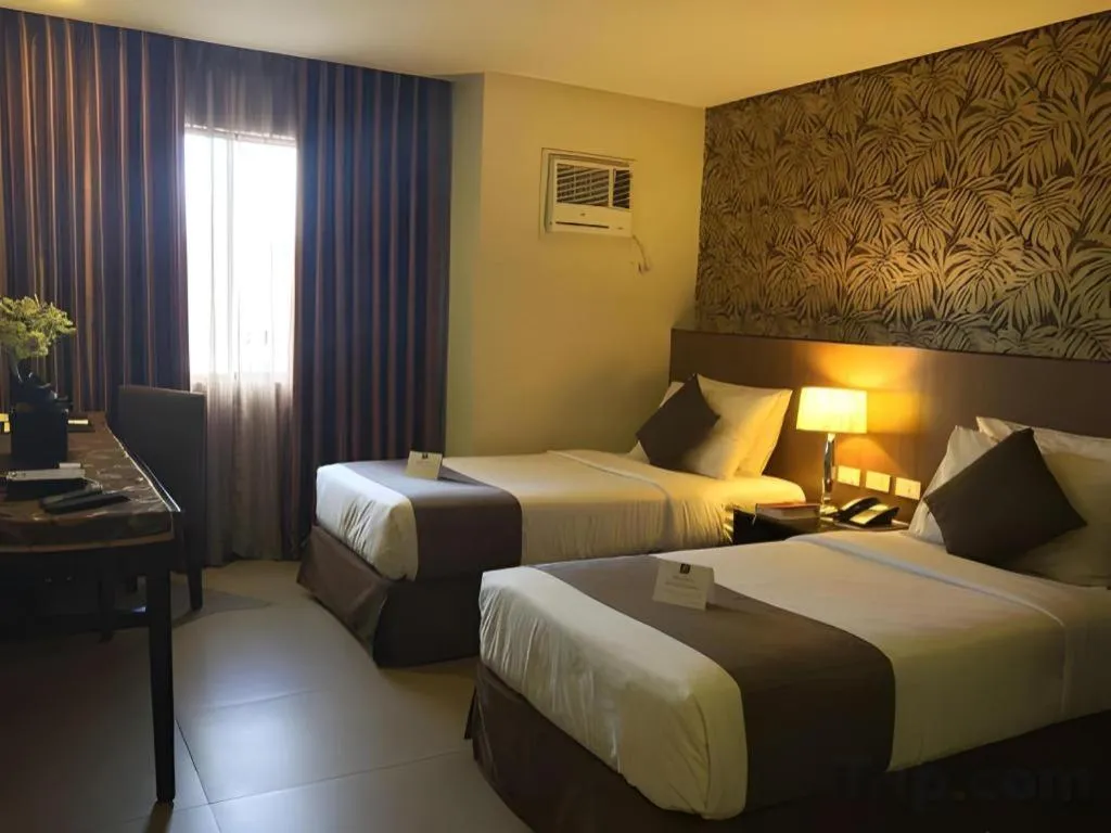 Bed in GT Hotel Bacolod