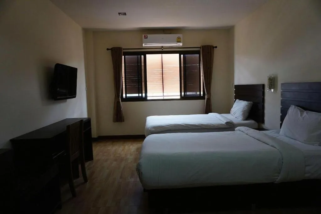 Bed in Ponburi Hotel