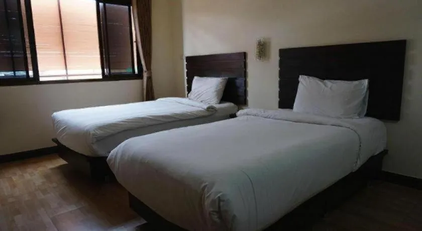 Bed in Ponburi Hotel