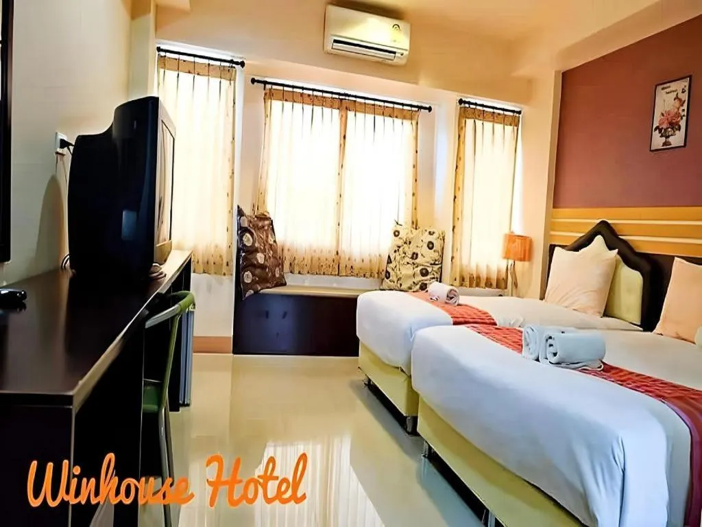 Bed in Winhouse Hotel