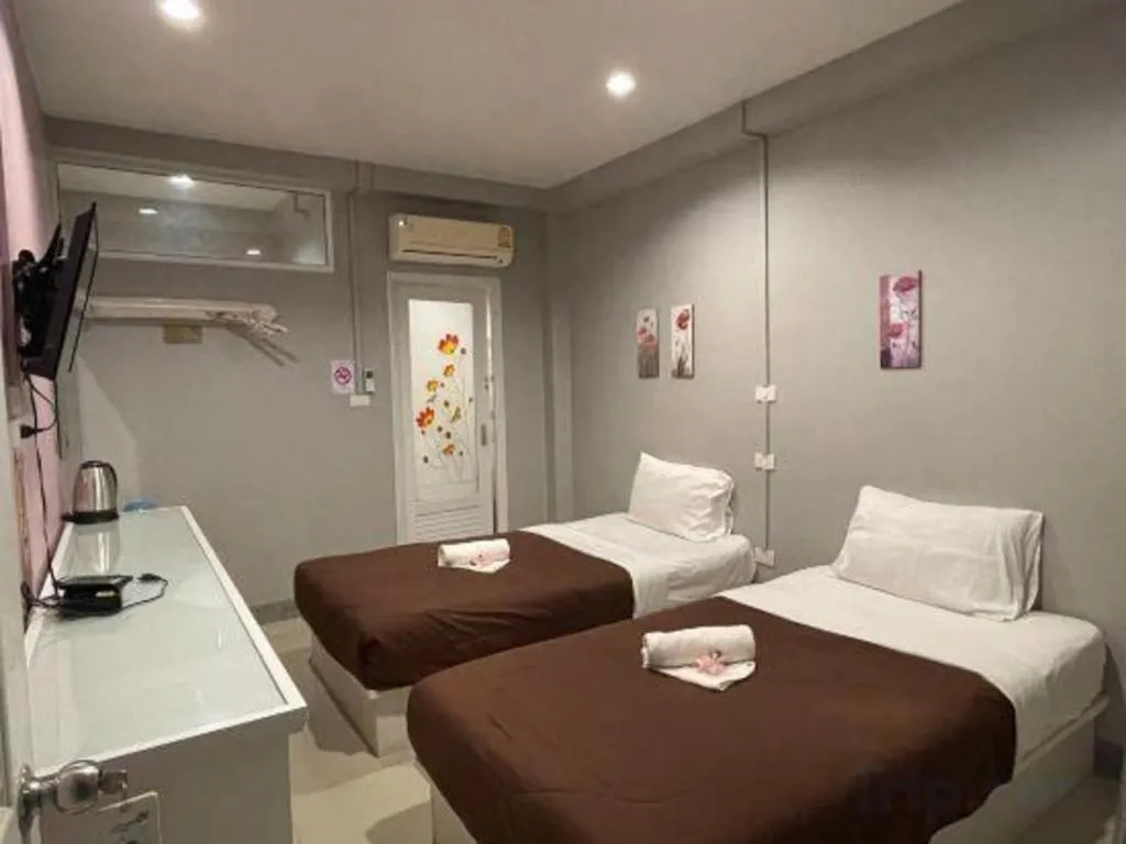 Bed in Winhouse Hotel