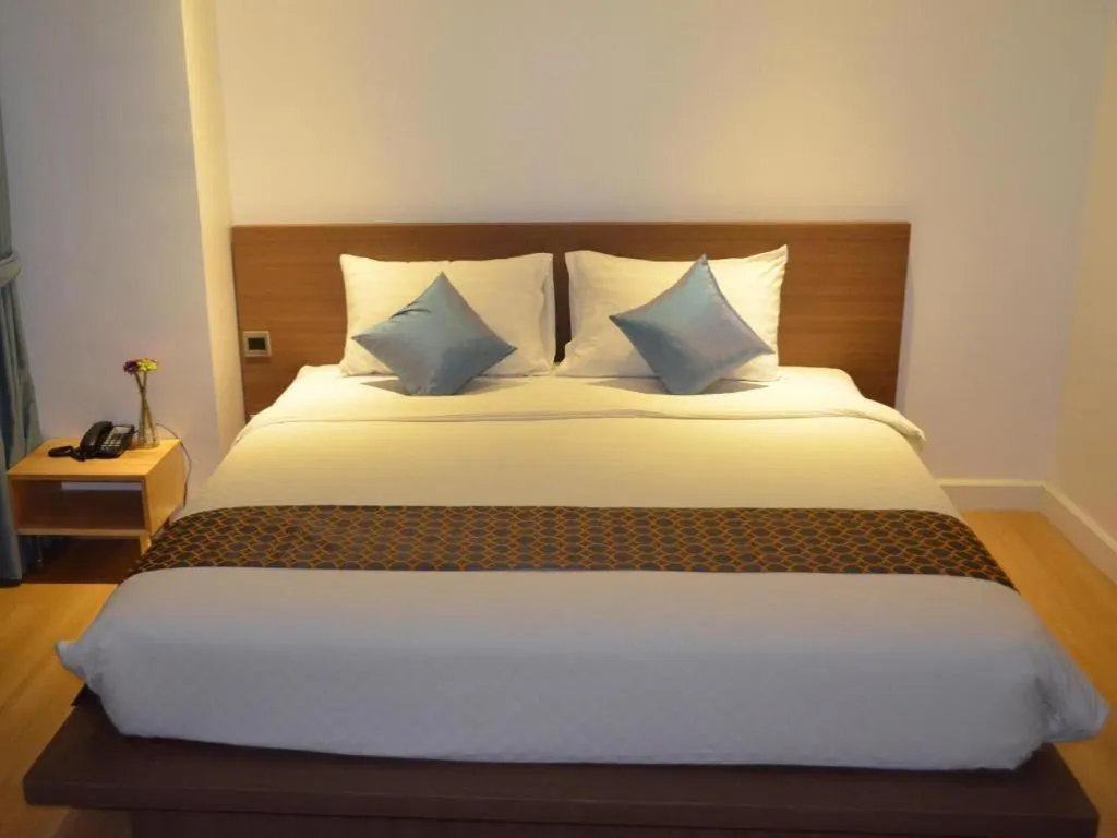 Bed in The Scenery City Hotel