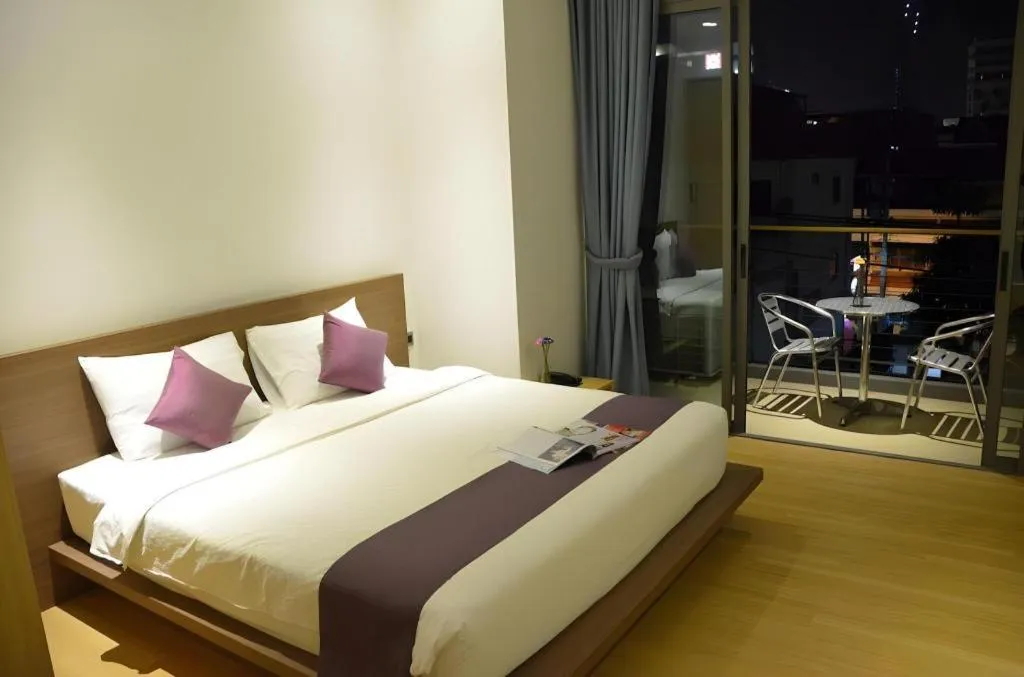 Bed in The Scenery City Hotel