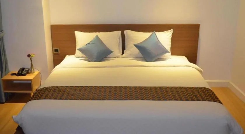 Bed in The Scenery City Hotel